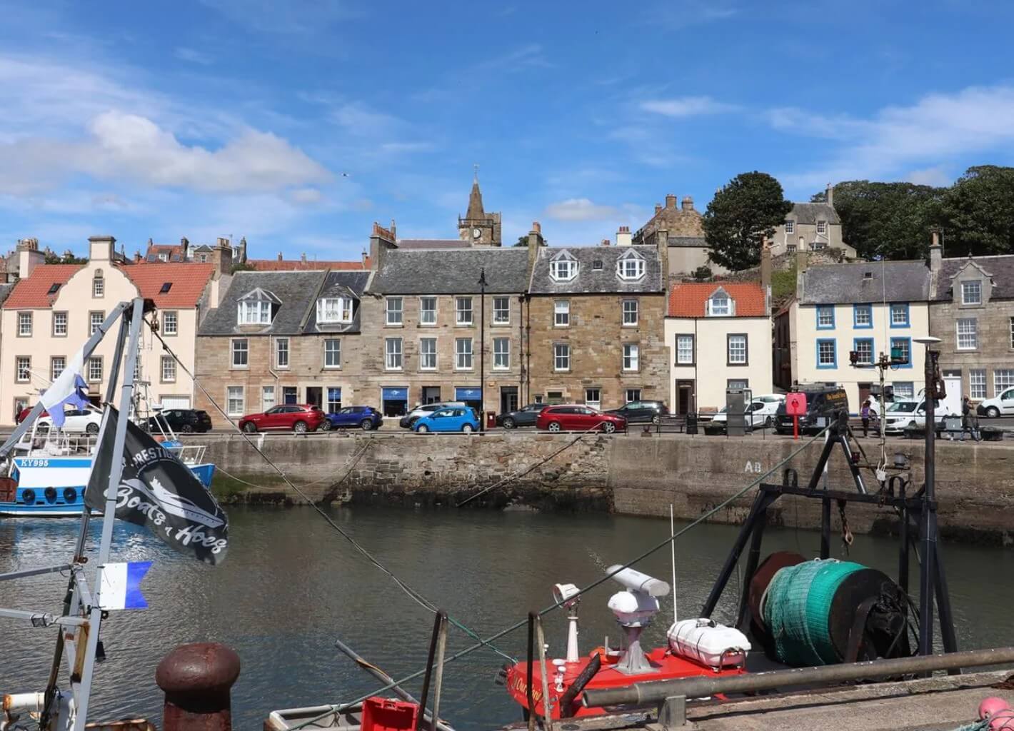 Pittenweem harbour with colourful fishing boats and traditional stone cottages